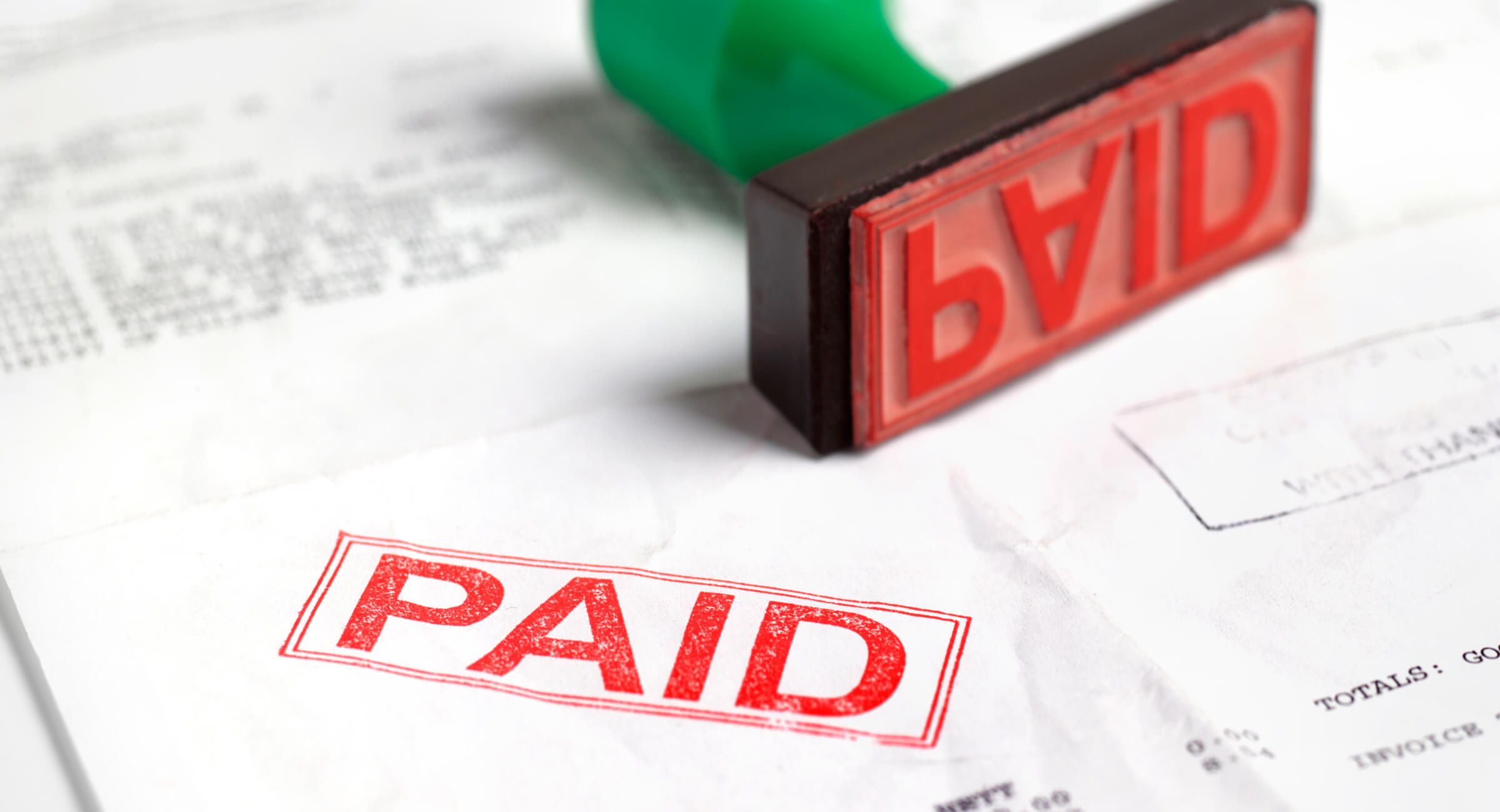 A loan statement with a red "paid" stamp on it.
