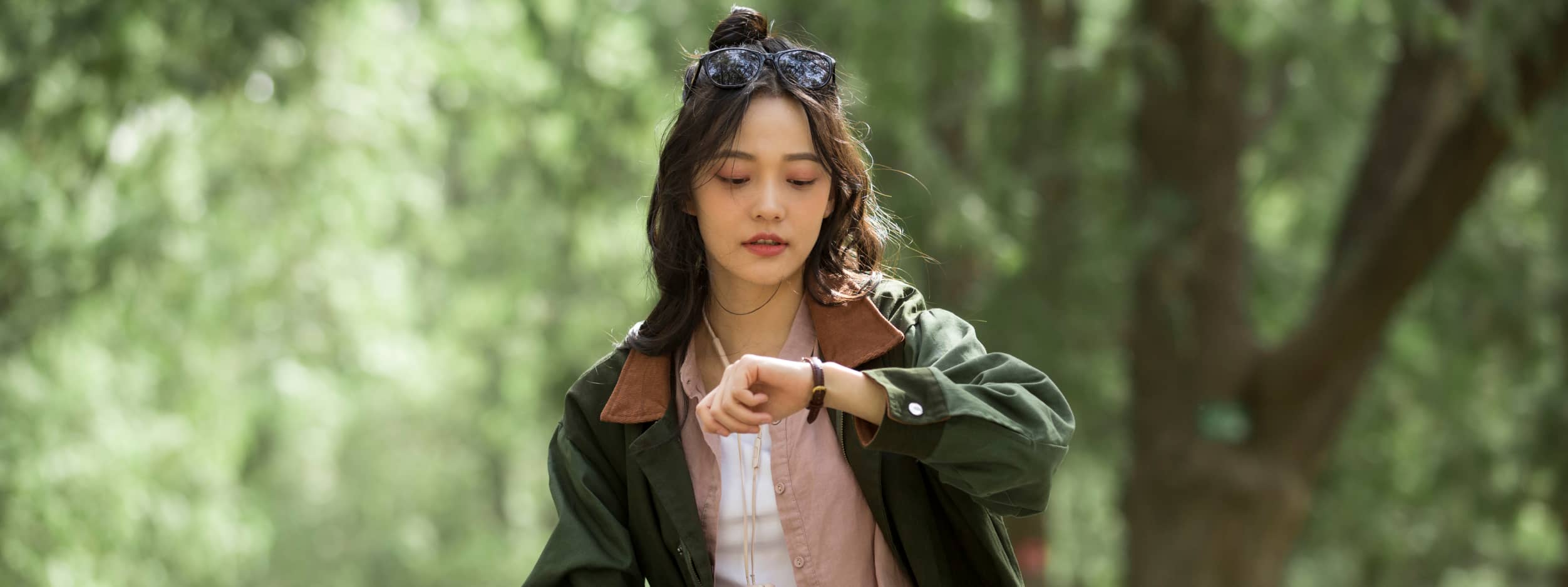 Woman looking at her watch.