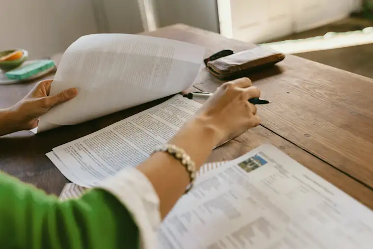 Consultant And Service - Landsape - Legal - Closeup of woman going through docs