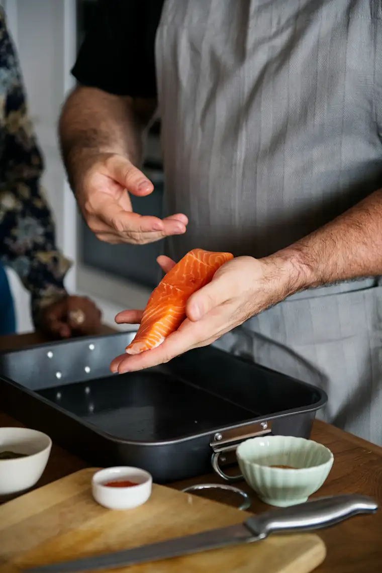 Food And Restaurants - Portrait - Sushi Restaurant - Chef Handling Raw Salmon