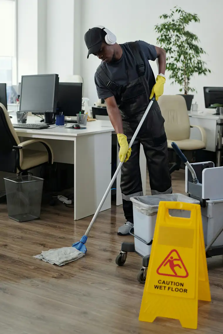 Cleaning - Portrait - Man mopping office floor