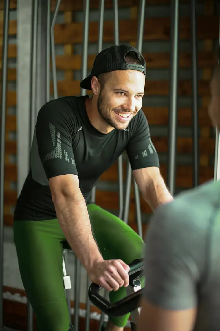 Beauty Wellbeing And Sport - Portrait - Cycling Coach - Action - Man training on cycling machine