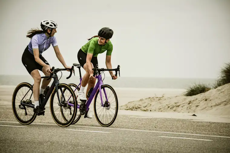 Beauty Wellbeing And Sport - Landscape - Cycling Coach - Action - Two people cycling outdoors