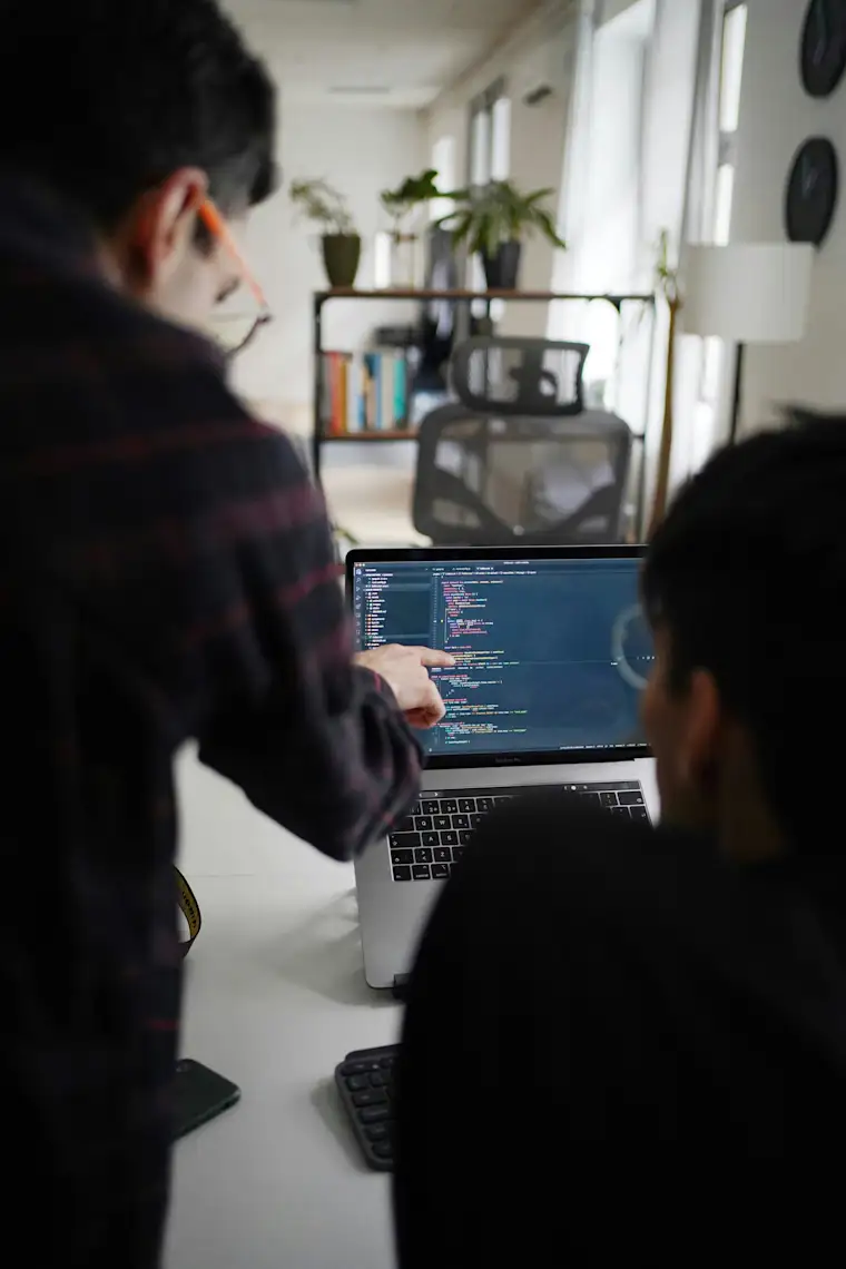 Developer - portrait - pointing at screen