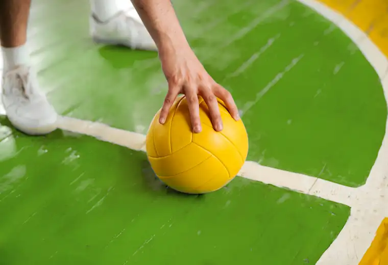 Beauty Wellbeing And Sport - Landscape - Handball Coach - Still - Closeup of hand placing ball on ground