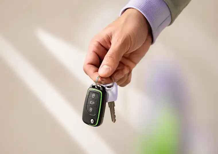 Man holding a car keys