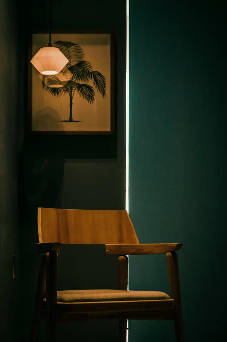 Interior decorator - portrait - Chair and green wall