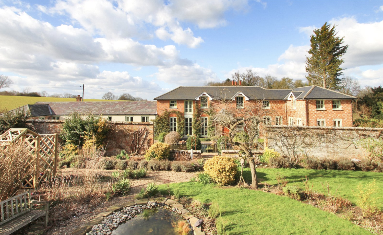 Stunning period red brick country mansion with mature gardens and shrubs surrounding