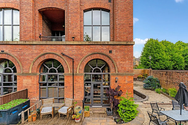 Exterior of an historic mill conversion in Bolton: offers over £275,000