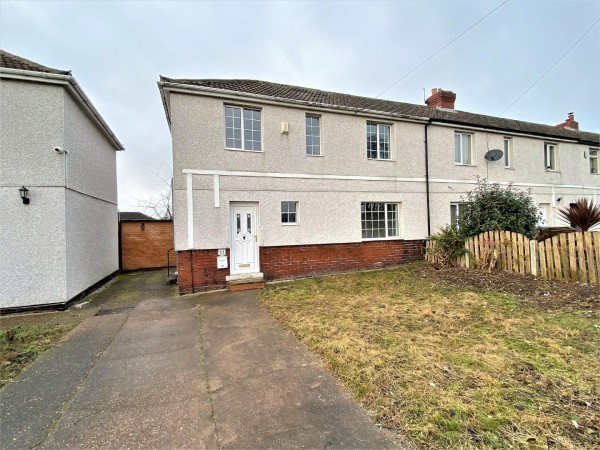 The exterior of the 9th most viewed property on Zoopla in 2023. The semi-detached home looks very ordinary with a pebble-dashed exterior, unloved front garden and concrete driveway.