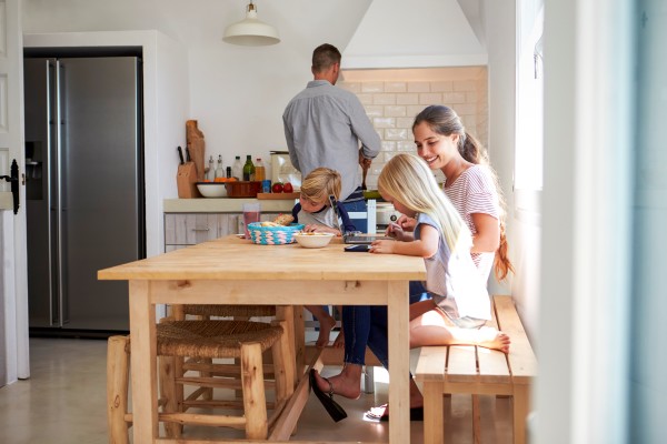 A family enjoying breakfast in their kitchen