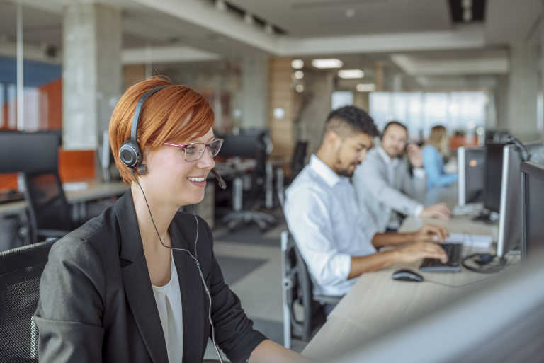 A mortgage advisor talking to a customer via a headset