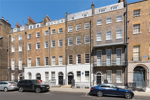 The exterior of an impressive 5 storey Georgian terraced home, where a third-floor flat sold for £12.65 million.