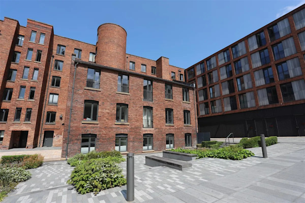 Exterior of a 2 bed-flat for sale in the world’s oldest steam-powered cotton mill, Manchester: £350,000