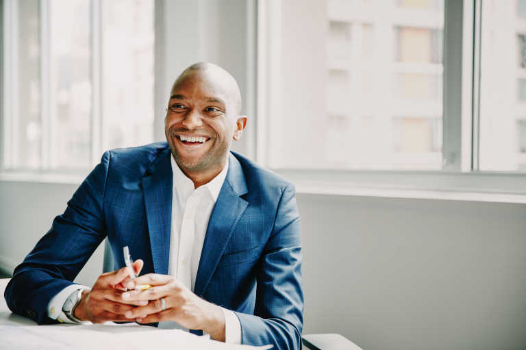 An estate agent smiling 