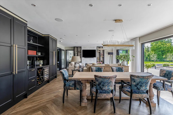 The large open-plan kitchen and lounge of a new-build home in Somerset