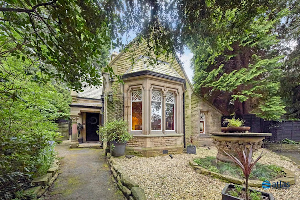 The exterior of a charming 4-bed lodge house for sale in Liverpool