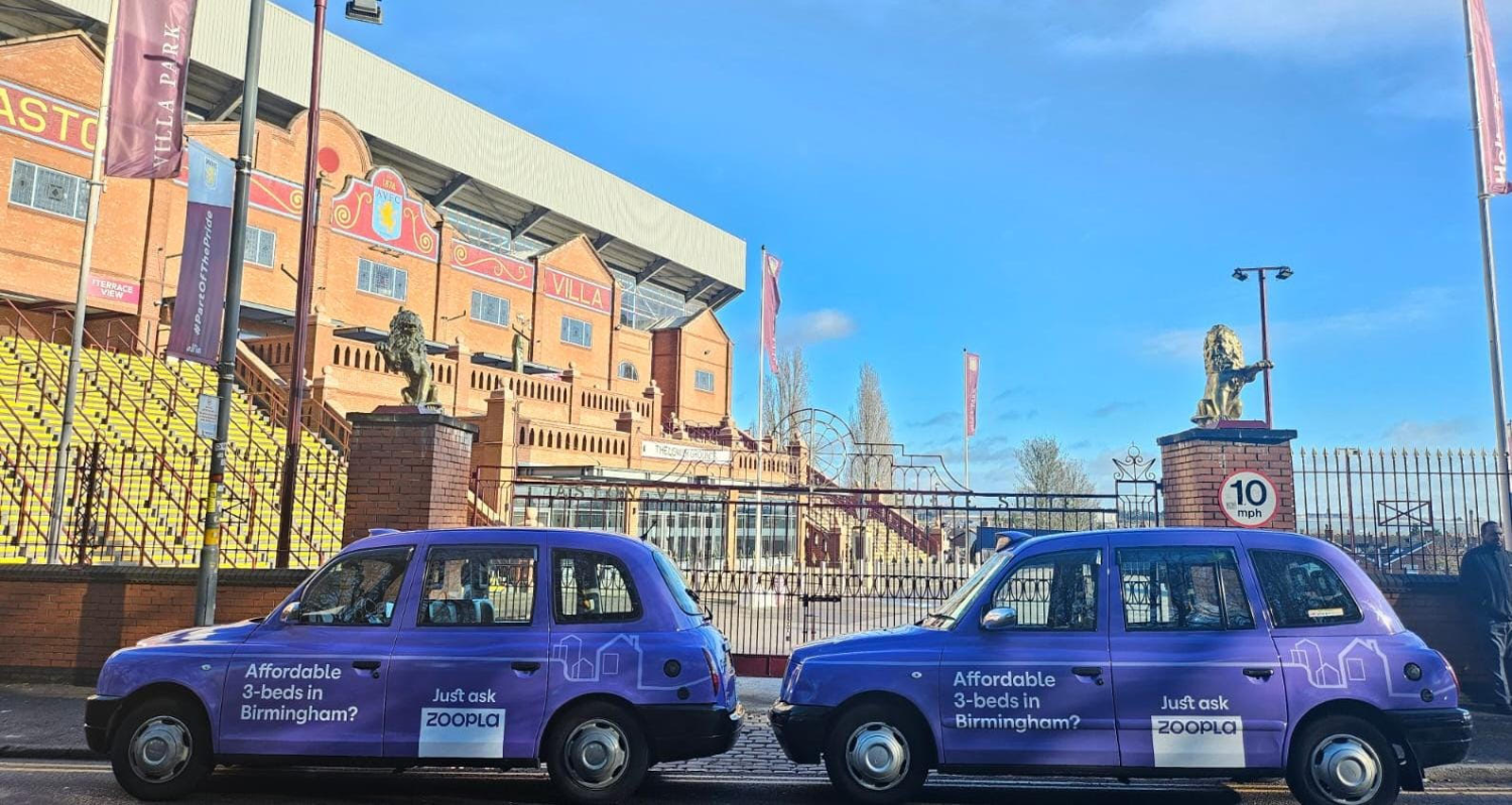 Two taxis wrapped in the Zoopla brand in Birmingham