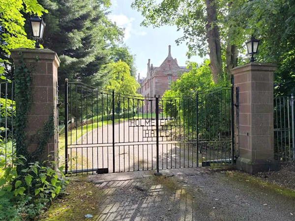 The gated driveway of a rare “calendar” mansion in Warwick Bridge, Carlisle