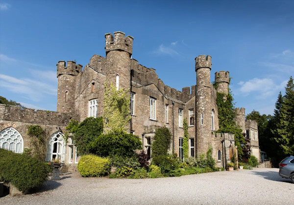 the exterior of a Jacobean castle with turrets