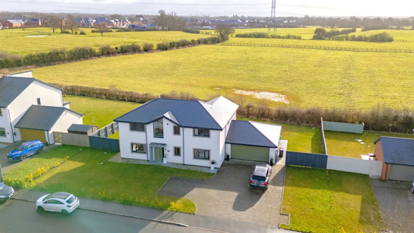 Aerial view of a large modern house for sale in a village near Preston