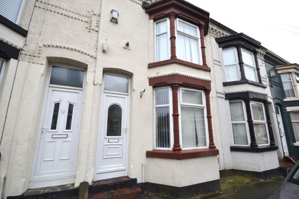 The exterior of a period terraced property with large bay windows available to rent in Liverpool