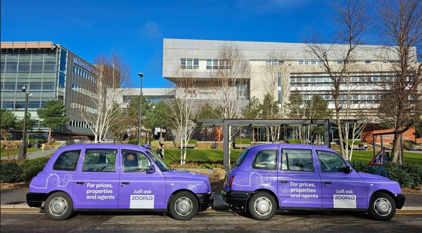 Two taxis wrapped in the Zoopla brand with the tag line "For prices properties and agents, just ask Zoopla"