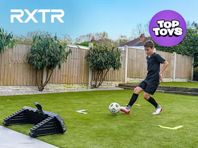 The RXTR Home Coach Interactive Rebounder on a black background with an insert image of a boy kicking a football.