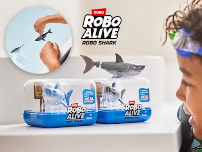 The Robo Alive by ZURU Swimming Robo Shark toy on display on a white shelf.