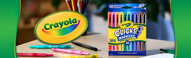 Crayola Clics markers on the green and yellow background 