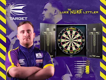 Luke Littler standing beside his Cabinet & Dartboard Set