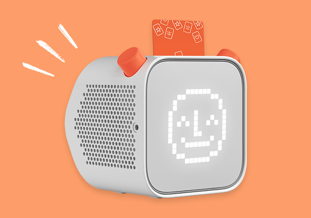 The Yoto Player on an orange background.