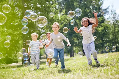 Boredom Busters Hero Image Blog Children Playing with Bubbles