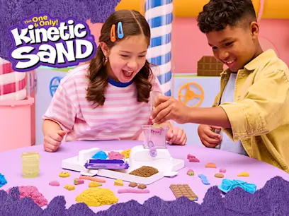 Kds having fun with Kinetic Sand Sweet Station Set