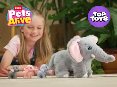 Two girls sitting on a lawn playing with the Pets Alive by ZURU Mommy Elephant and Baby Surprise Set