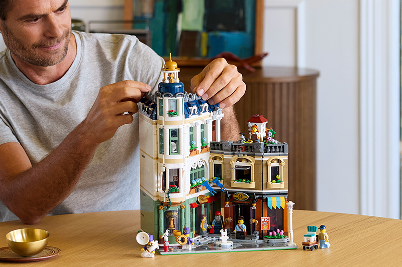 The LEGO Icons 11371 Shopping Street Set Adults on a black background