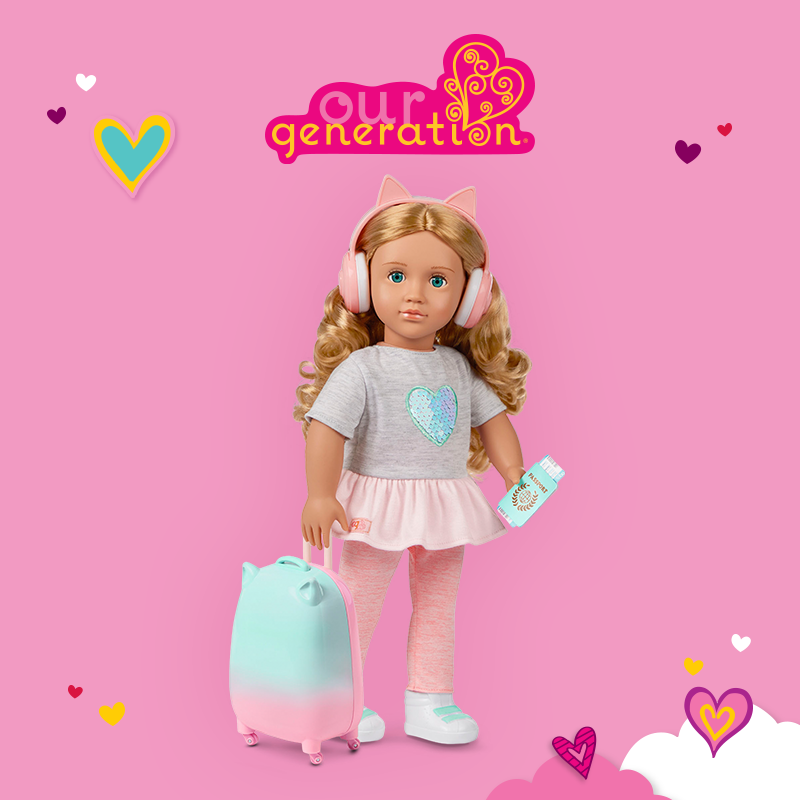 Travel Doll Linzi is ready for adventures with travel accessories on the pink background 