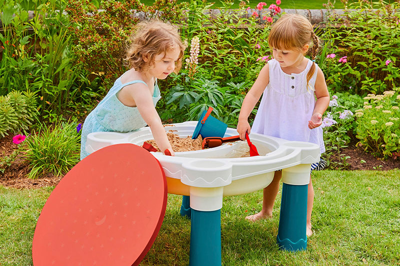 Boredom Busters Blog 3-5 Years Duplex Banner 3 - Image - two children playing with a sand and water table