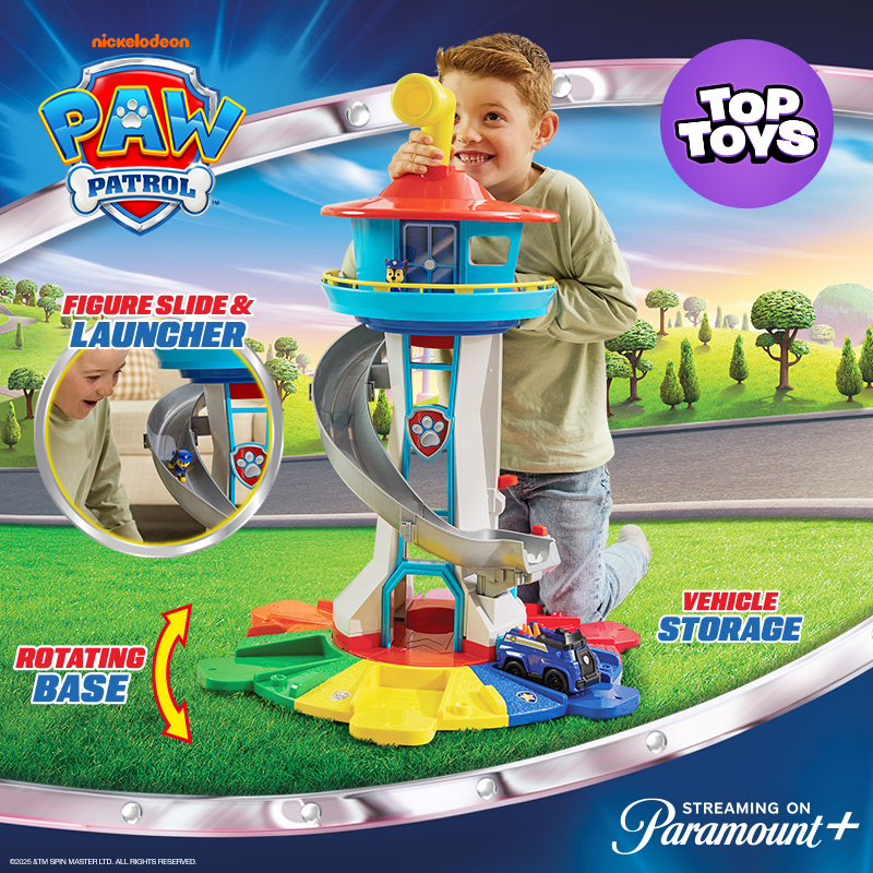 Boy kneeling behind the PAW Patrol My Size Lookout Tower with Vehicle and Figure on a Paw Patrol cartoon background