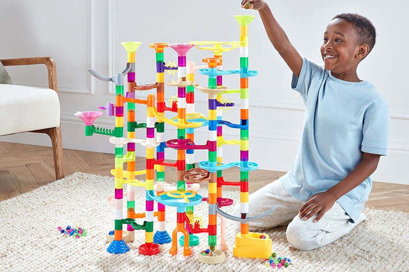 Boredom Busters Blog 6-8 Years Duplex Banners 1 - Image - Child playing with a marble run maze