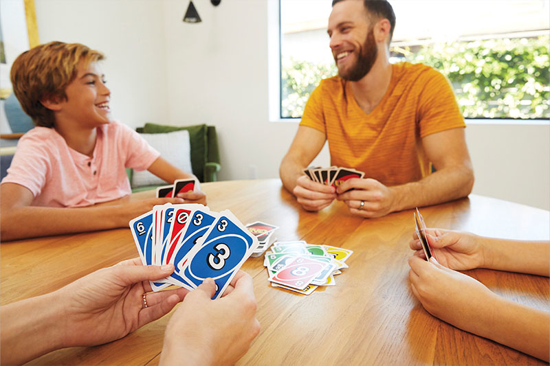 Boredom Busters Blog 9-11 Years Duplex Banners 3 - Image father and son playing uno card game