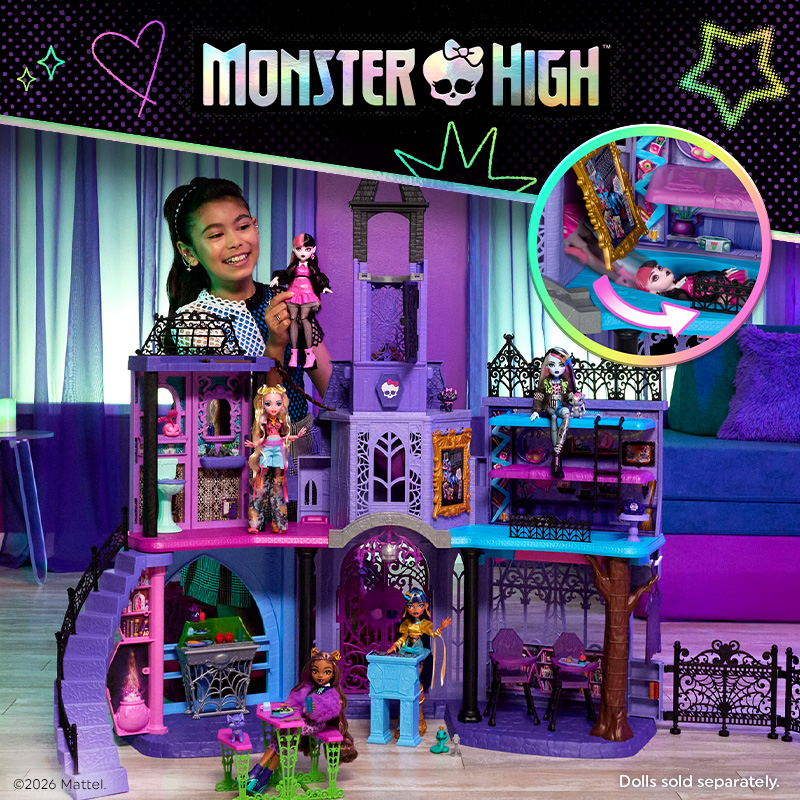 Monster High toy playset featuring a multi-level purple and turquoise haunted mansion with gothic arches, spiral staircases, ornate railings and colourful rooms. Several Monster High dolls are displayed throughout the house.