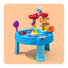 Kids playing at a sand and water table