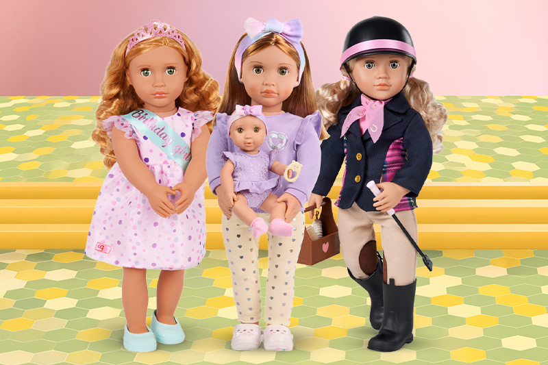 Four Our Generation Dolls standing in a row