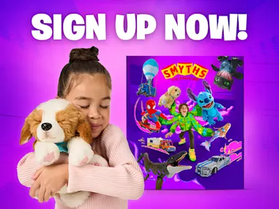 A girl hugging a puppy toy with the Smyths Toys Superstores toy catalogue 2025 in the background. The background colour is pink and purple.