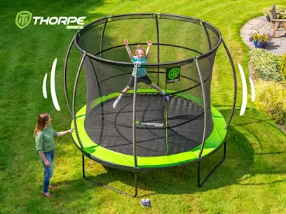 Kid jumping on a 10ft Thorpe Sports Trampoline with woman standing beside the trampoline