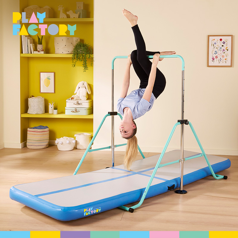Girl using the Play Factory Gymnastic Bar & Gym Mat Bundle in a brightly lit room. 