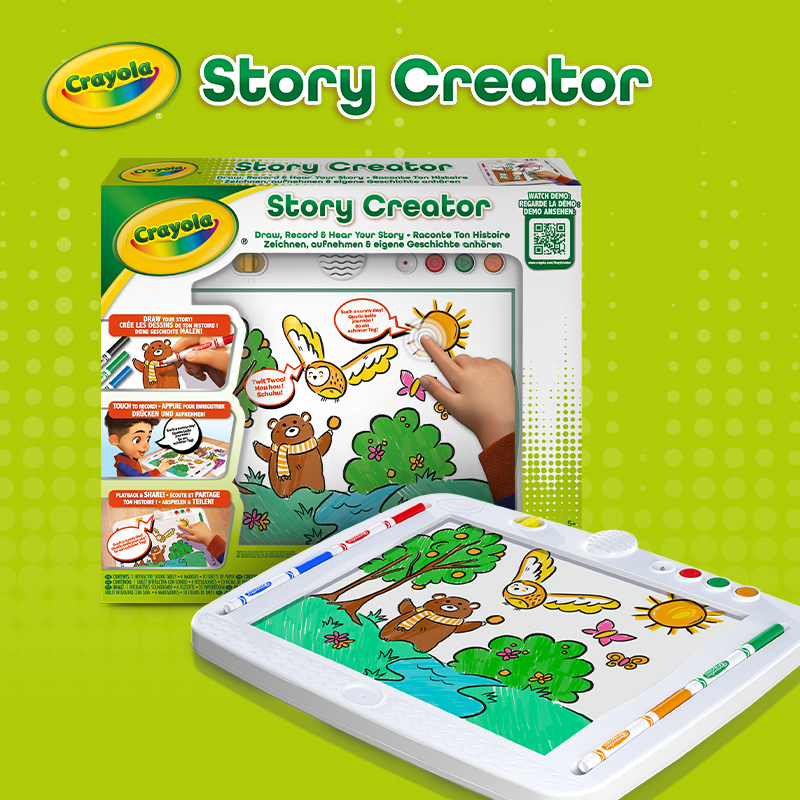 Crayola Story Creator product box and drawing tablet with markers, showing a bear and bird scene; "Draw, Record & Hear Your Story" on a green background.