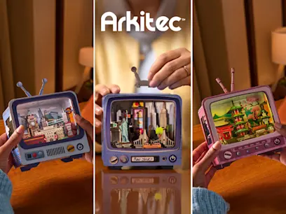Three Arkitec miniature TV-style building sets showing London, New York and Japan-themed city scenes, with hands holding or assembling the retro television-shaped models.