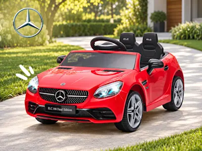 Red Mercedes-Benz SLC 300 Final Edition-style electric ride-on car with two black seats, displayed on a paved path beside a lawn. The Mercedes-Benz logo appears in the upper-left corner.